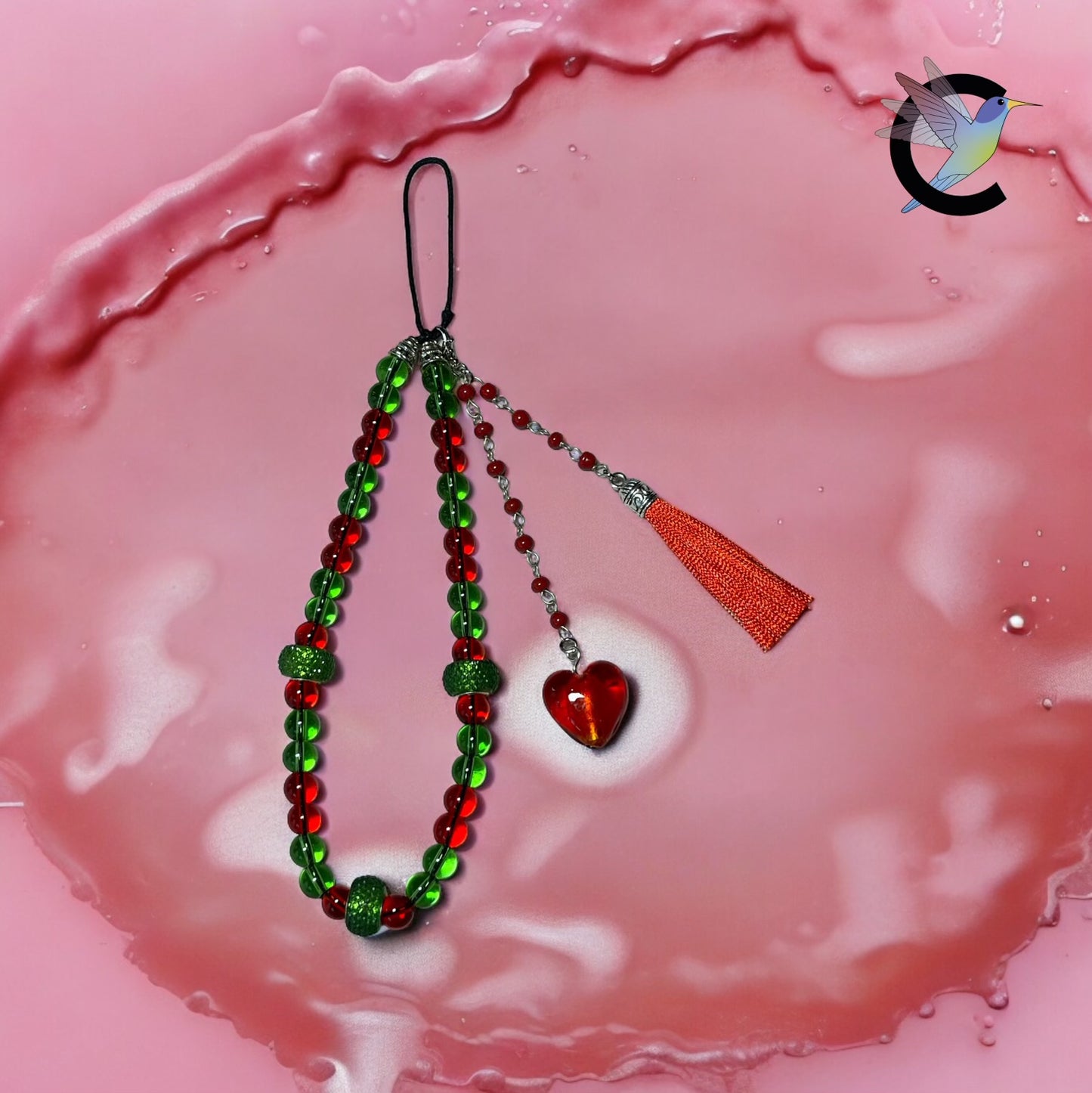 Éclat de Cœur : Bijou de Téléphone avec Cœur en Verre de Venise et Pompon Rouge